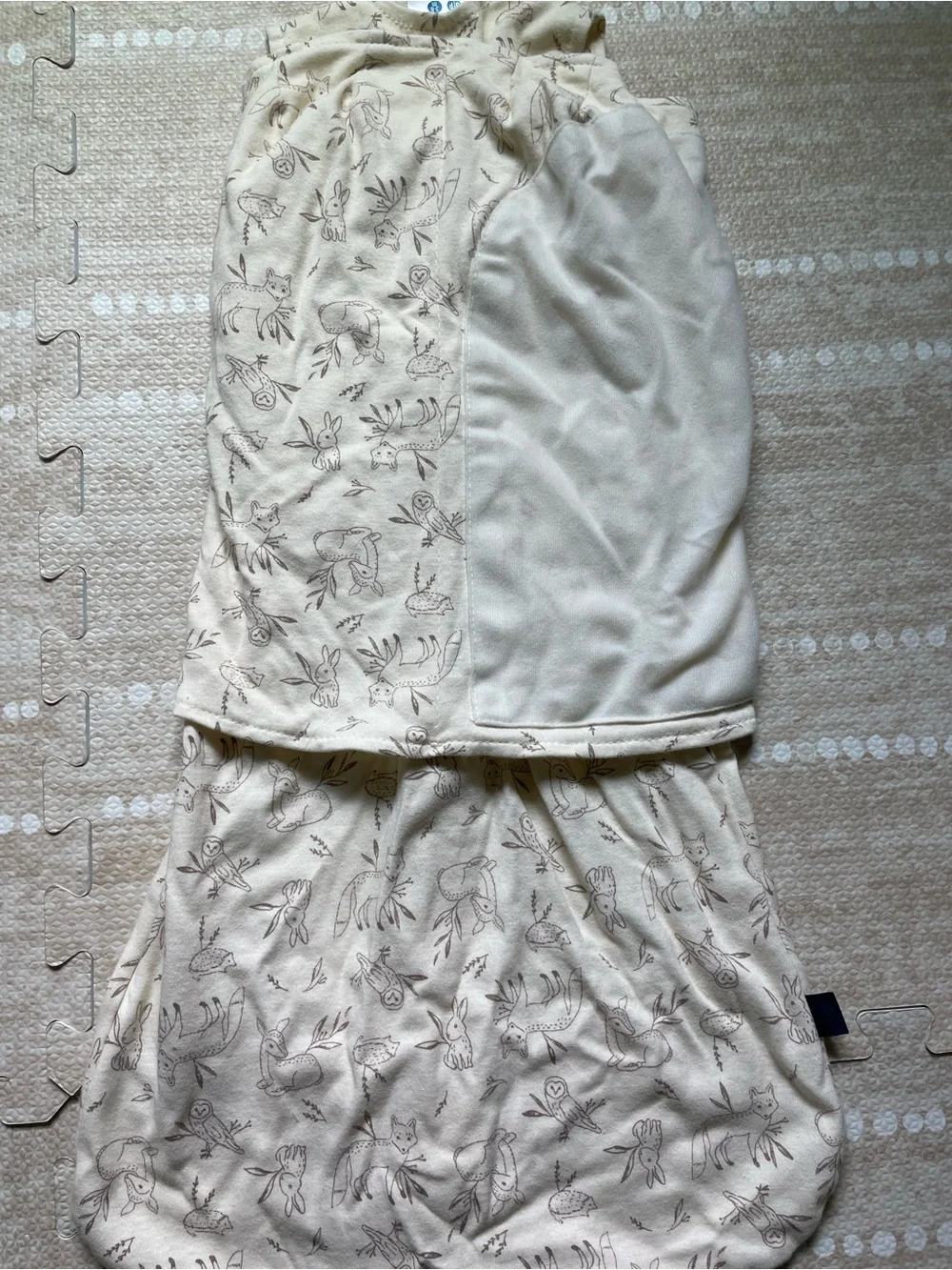 Halo SleepSack Swaddle in Cream with Brown Animal Print